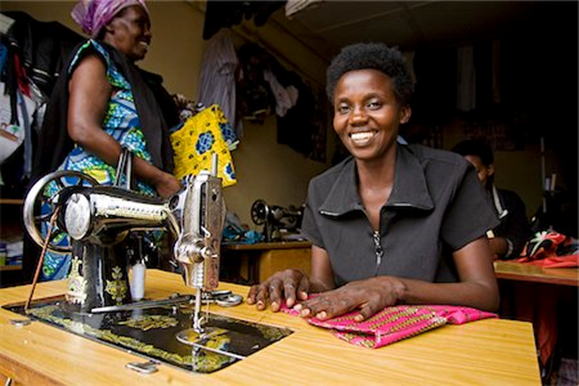 Congolese woman learning sewing skills in vocational class